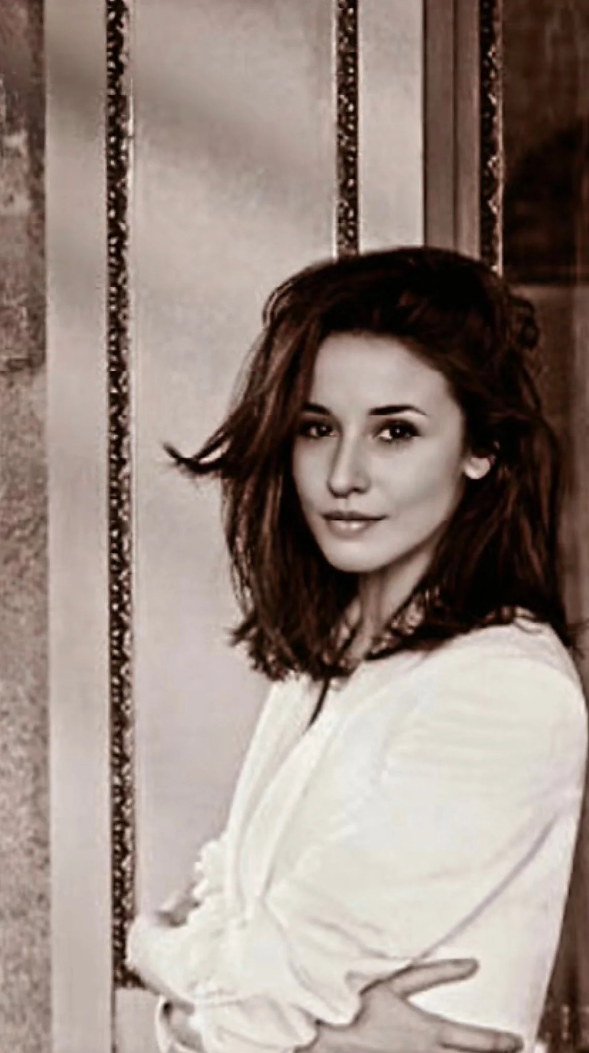 Black and white portrait of Gabriella Vittoria Monti, founder of GVM, in a historic interior